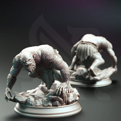 Three Trogg Cannibal miniatures in various poses: one standing, one crouching, and one crawling. All are on rocky bases, showcasing their fierce and monstrous features.