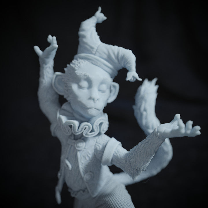 Close-up of Dancing Monkey figurine's facial expression, wearing a jester hat with eyes closed, mid-performance.