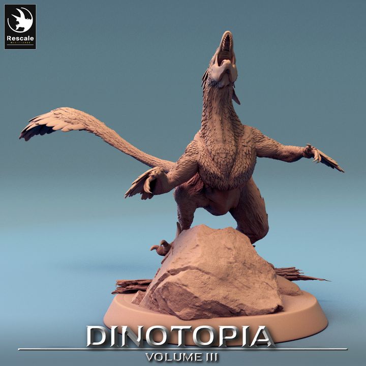 Pyroraptor model standing on a rock with wings spread and head raised.