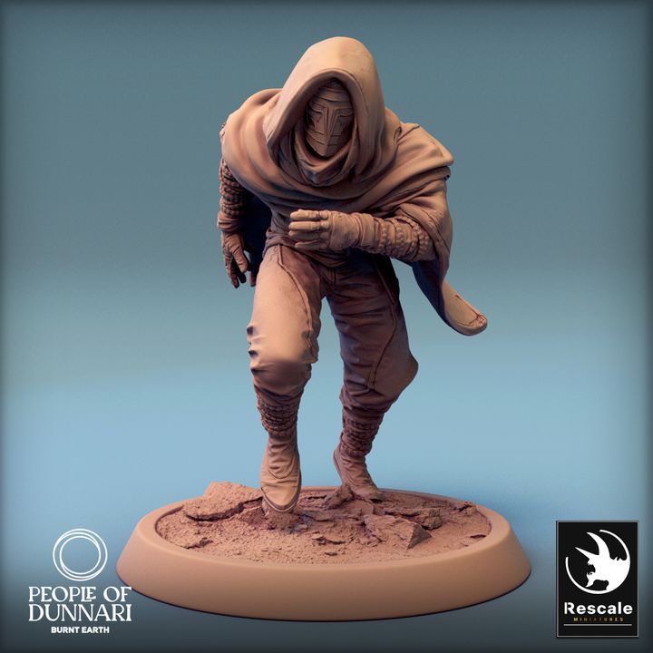 A hooded figure of the Amarok Sandweavers, crouched and ready to move, wearing desert survival gear.