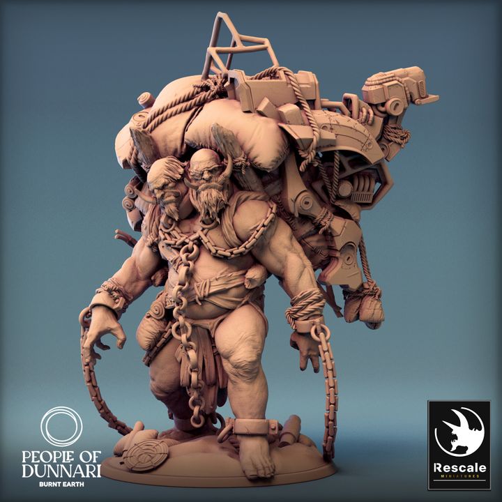 Sand Ettin standing with a large scavenged machinery pack, two heads, chains, and tattered clothing.