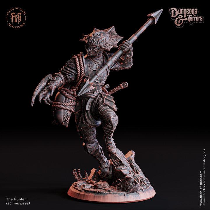 The Hunter miniature, inspired by the Predator, posed with a spear and advanced armor, stalking its prey on an alien world.