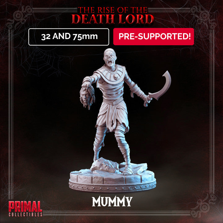 Mummy miniature holding a severed head and a khopesh, wrapped in tattered linen, standing on a rocky base.