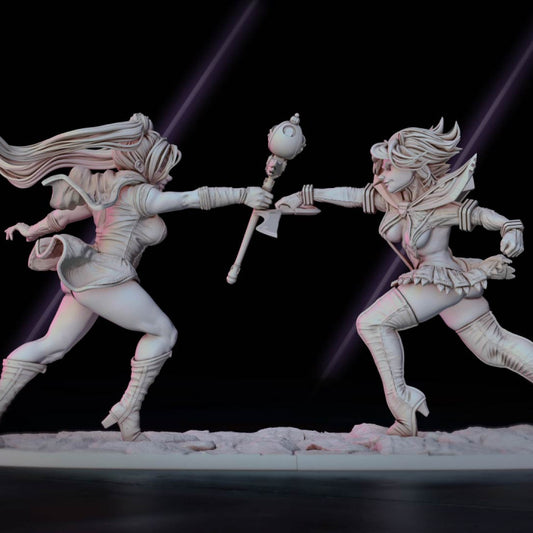 Magical Girls, two figures locked in a dynamic duel, each wielding a magical staff, depicted in a detailed miniature set for tabletop RPGs or collectors.