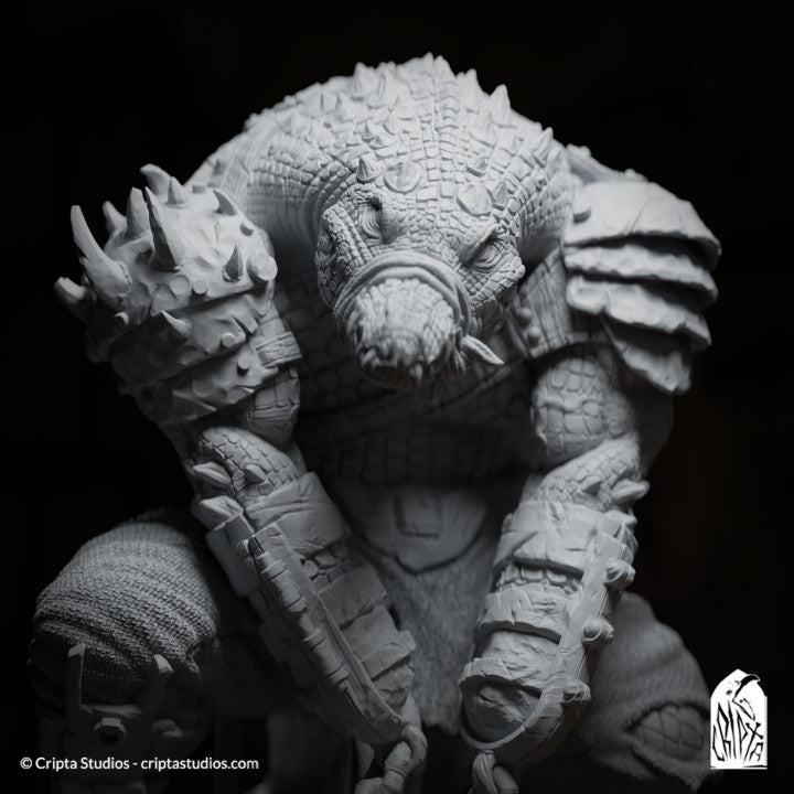 Close-up of Kothar Skran, lizardman prisoner with bound mouth and armored arms, looking menacing even while restrained.