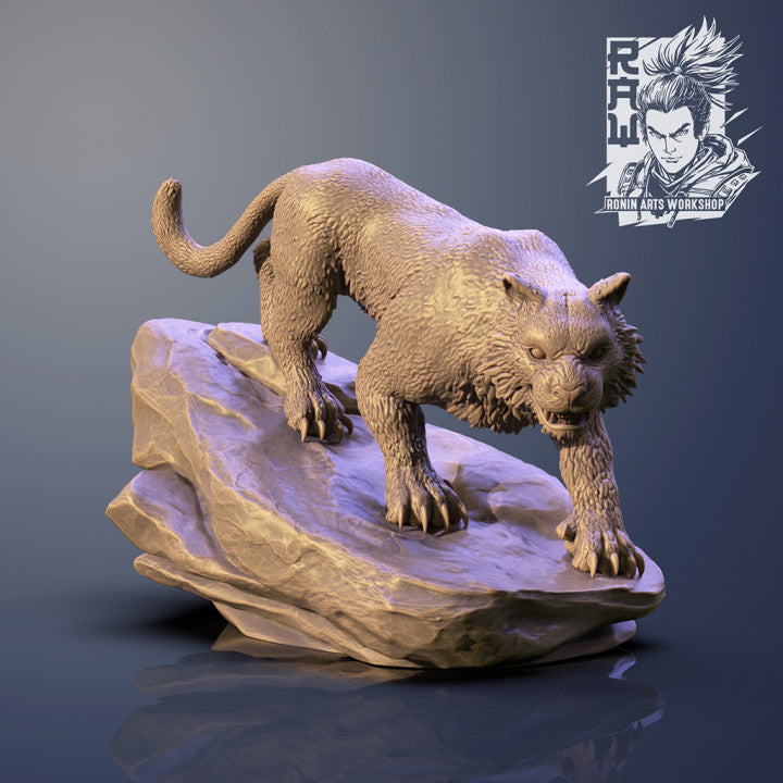 Jasmit Tiger miniature standing on a rocky base, displaying sharp claws, muscular body, and a focused predatory stance.