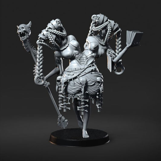 Twin Sisters, a conjoined twin figure wielding distinct weapons and adorned with chains, depicted in a detailed miniature for dark fantasy tabletop RPGs.