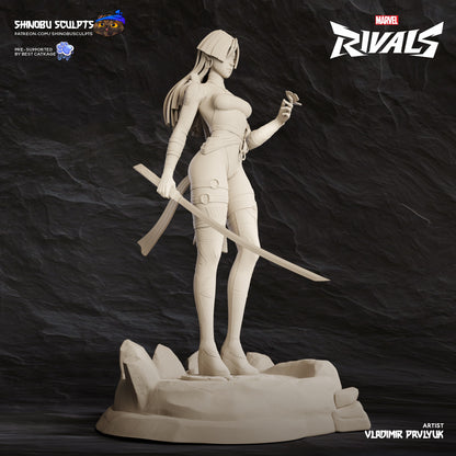 Psylocke Marvel Rivals statue unpainted full-body view holding katana with one hand and psi-butterfly in the other, posed on rocky base.