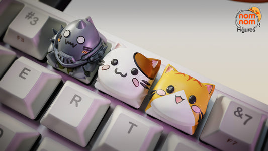 Alphonse and Cats Fullmetal Alchemist custom keyboard keycaps set featuring armored Alphonse Elric and two cat-themed artisan caps on a mechanical keyboard