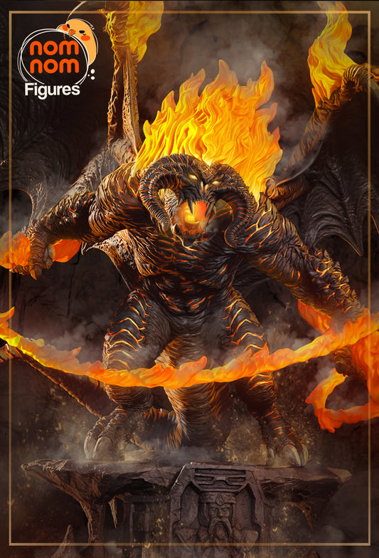 Fully painted Balrog statue with glowing flames, blackened armor-like hide, and fiery whip posed above a dwarven stone pedestal.