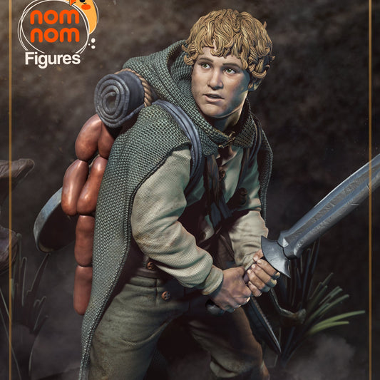 Samwise Gamgee painted 1:10 scale collectible figure holding a sword, wearing a cloak and backpack with cookware, standing on a forest-themed base.