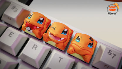 Charmander keycap set with three expressions on mechanical keyboard