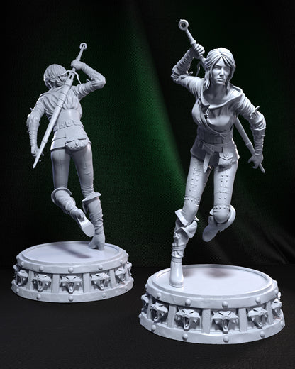 Unpainted Ciri figure in charging pose, viewed from front and back, standing on a sculpted base with snarling wolf medallions.