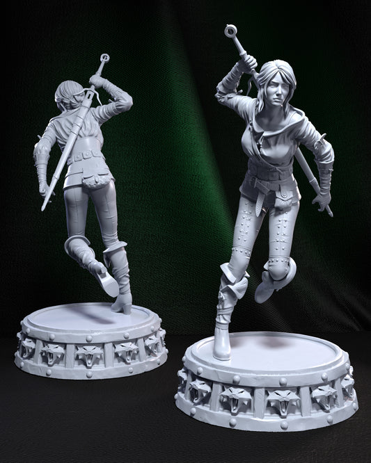 Unpainted Ciri figure in charging pose, viewed from front and back, standing on a sculpted base with snarling wolf medallions.