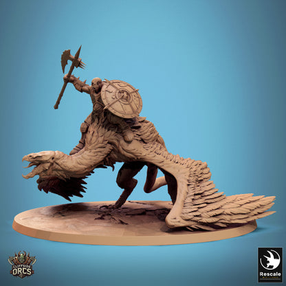 A Giant Vulture miniature with its rider gripping a weapon and shield, showcasing feathered wings and a dynamic stance.