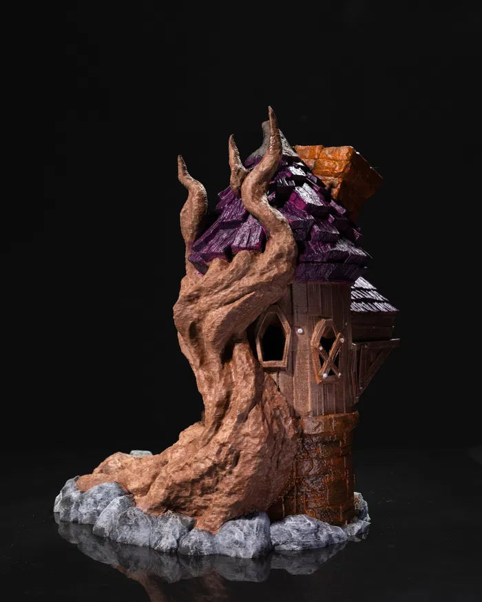 Back view of the Wizard Dice Tower with tree roots entwined around a magical cottage.