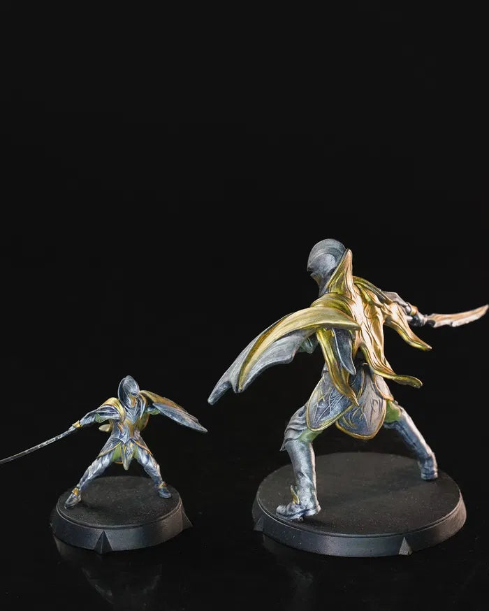 Elven Soldier in golden armor wielding a sword and shield, shown in both 32mm and 75mm versions.