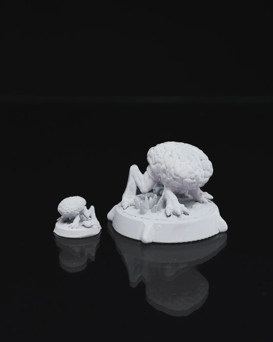 Intellect Devourer miniature in a crouched position with a brain-like body and clawed limbs, on a plain round base.