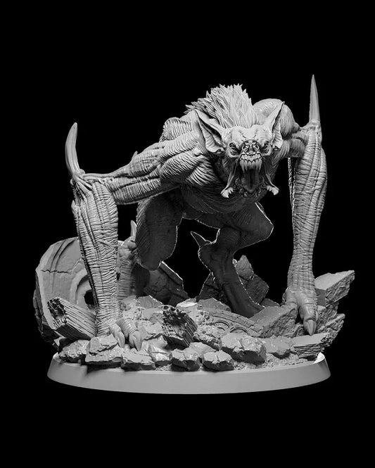 Dire Bat miniature perched on a crumbling stone base, wings spread wide, ready to attack.