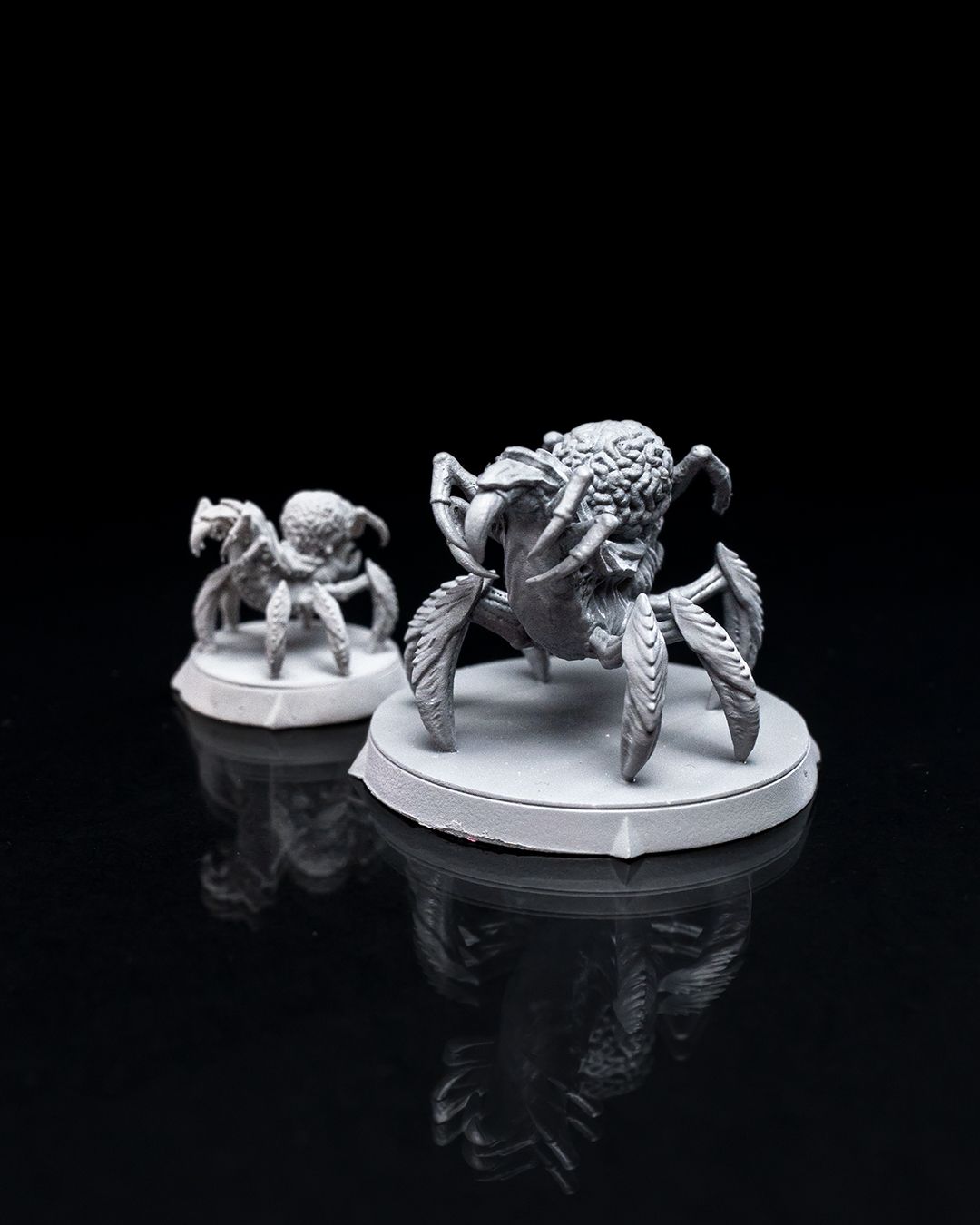 Intellect Devourer miniature with multiple legs and a detailed brain-like head, side view, showing intricate sculpting on its limbs.