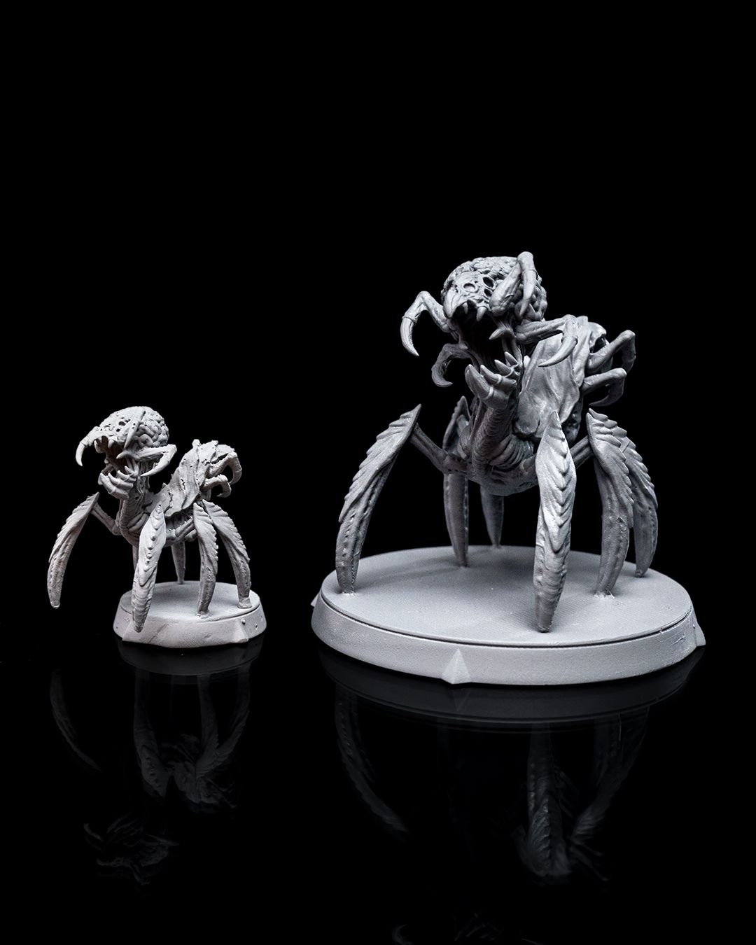 Intellect Devourer miniature with multiple legs and a detailed brain-like head, front view, standing on a round base