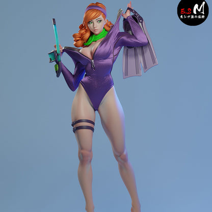 Daphne Divesuit painted 1:6 scale figure front view in partially unzipped purple divesuit, green scarf, diving knife strap, and detailed sand base.