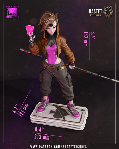 Female Gambit 1:8 scale figure painted version holding charged cards and staff, displayed on stacked card base with full color detailing and measurements