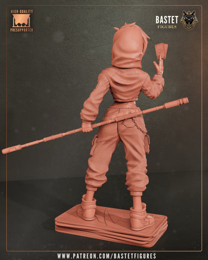 Female Gambit 1:8 figure unpainted rear view showcasing jacket, pants, staff, and card-stack base.