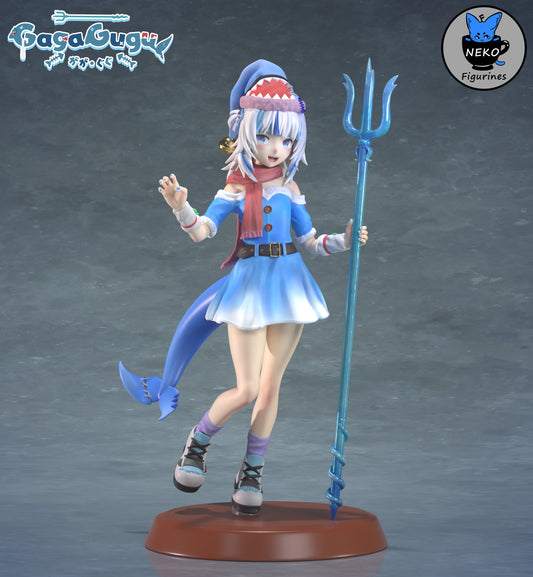 Gawr Gura figure in a blue dress with shark hat, trident in hand, posed mid-stride with scarf and fang-toothed grin on a display base.