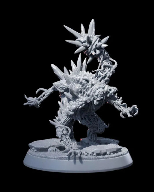 Gore Fiend miniature with grotesque spikes and twisted limbs, posed in a menacing stance on a rocky base.