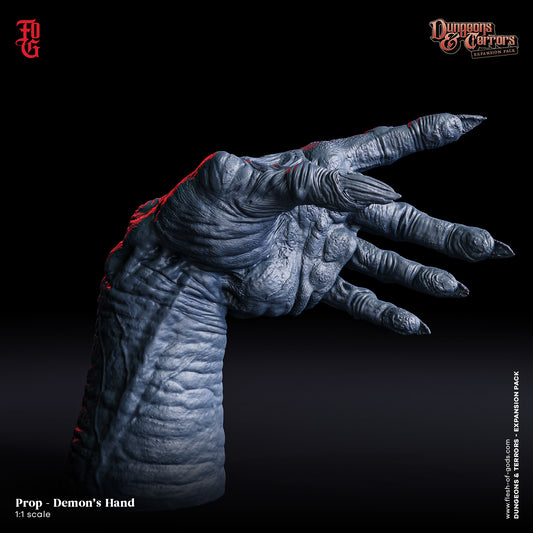 A detailed 1:1 scale model of a demon's hand, posed with fingers spread. The hand showcases realistic textures with claw-like nails, perfect for enhancing horror elements in TTRPG settings or as a collectible piece for fans of dark fantasy.