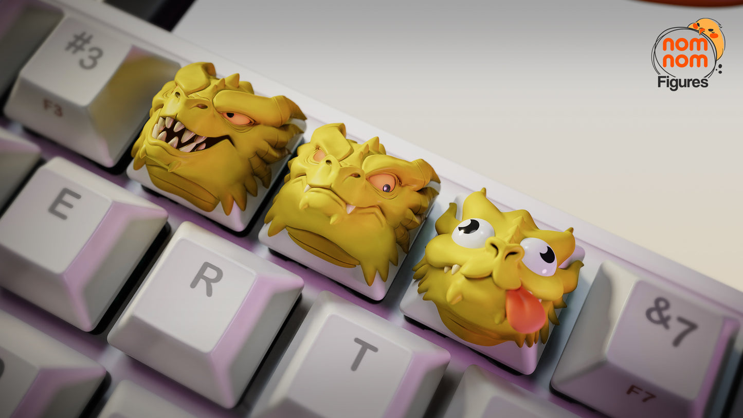 Derpy Hydra Meme keyboard keycaps set with three dragon heads in fierce, serious, and derpy expressions on a mechanical keyboard