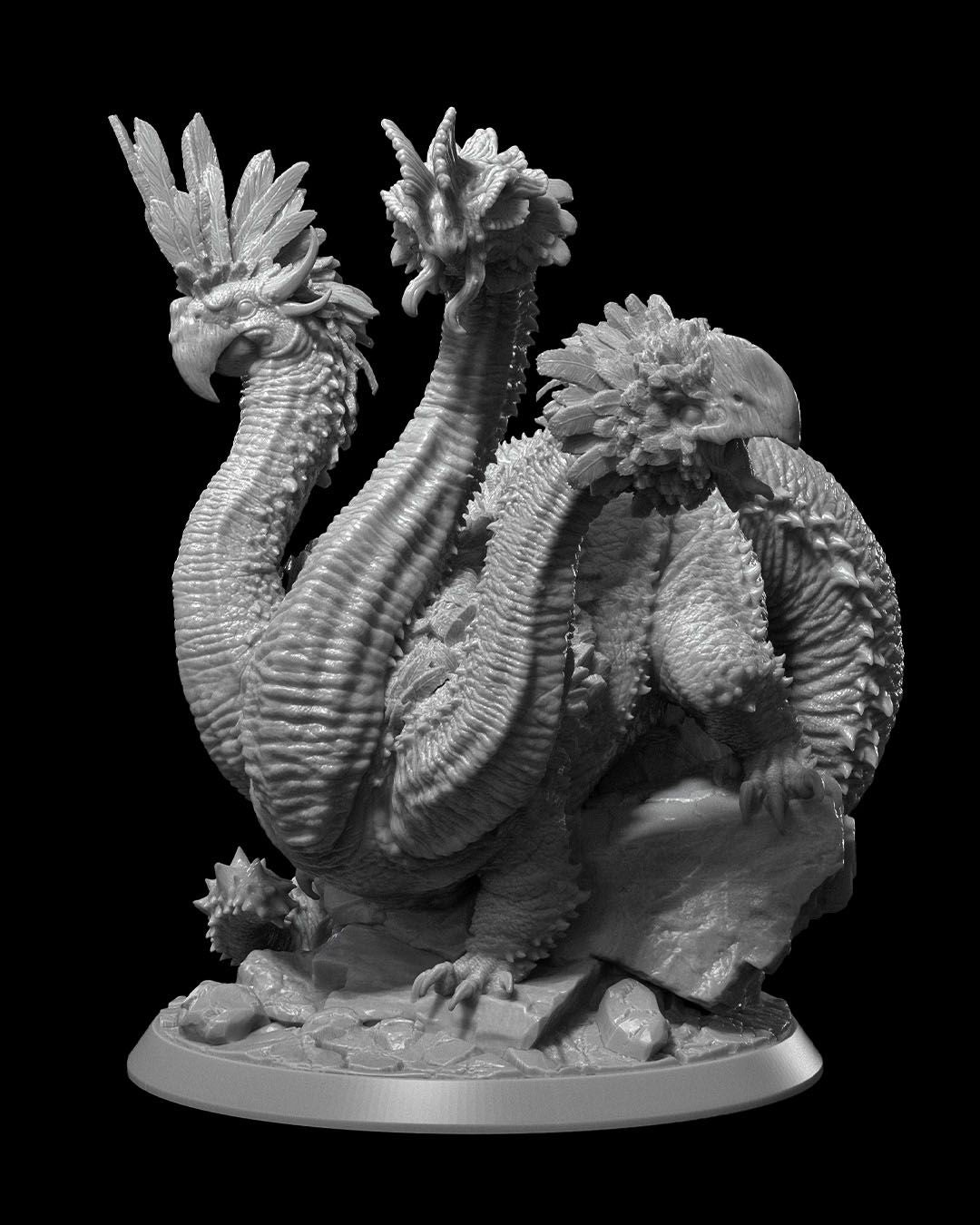 A Hydratrice miniature, a bird-like hydra with multiple feathered heads and elongated serpentine necks. The creature stands on a rocky base, showcasing detailed scales, feathers, and dynamic poses of its heads.