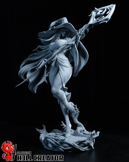 Front view of the Recluse sorceress figure posed casting a spell, staff held forward, with detailed clothing folds and dynamic movement.