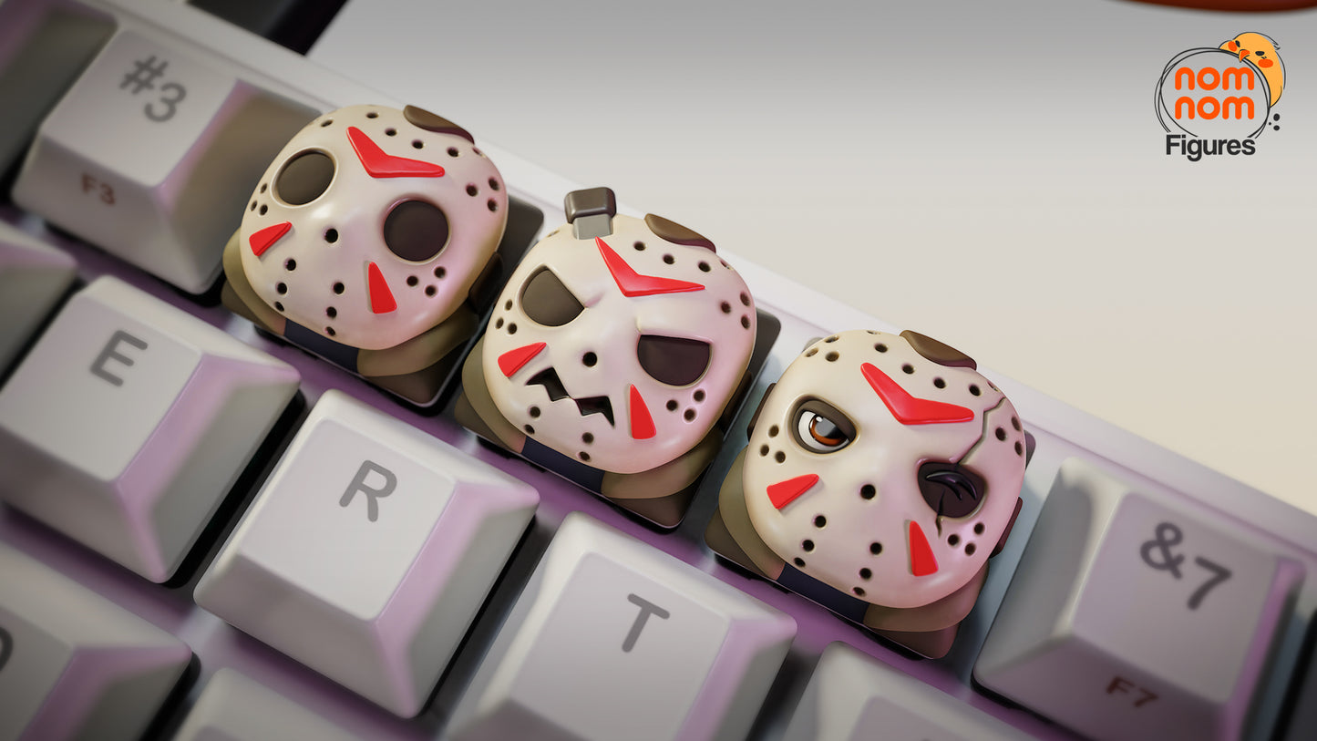 Close-up of Jason Voorhees keycaps with detailed hockey masks, scars, and expressions – NomNom Figures Halloween collection.