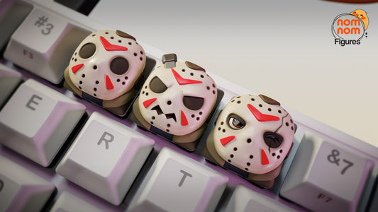 Close-up of Jason Voorhees keycaps with detailed hockey masks, scars, and expressions – NomNom Figures Halloween collection.