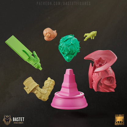 Exploded view of Joker bust model showing head, coat, hand, card, and base elements in separate parts.