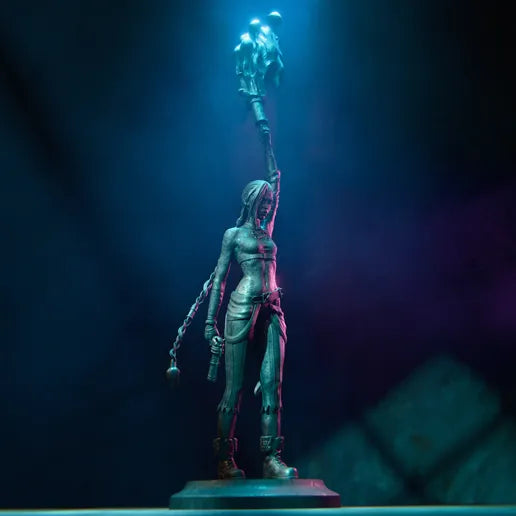 Full-body figurine of Jinx from League of Legends, standing with a mischievous smirk, braided hair, and holding her iconic weapon.