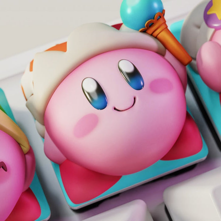 Classic Kirby artisan keycap with smiling face and staff accessory on mechanical keyboard key