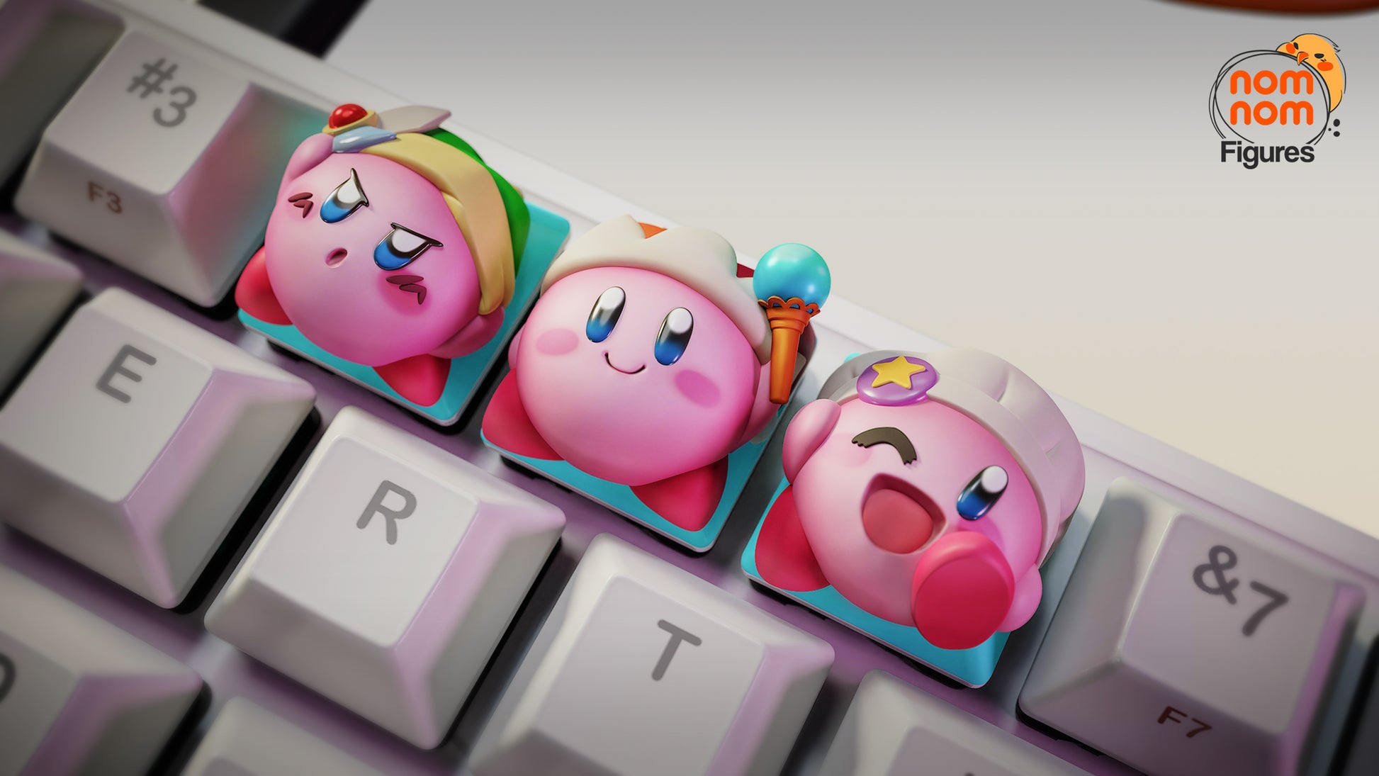 Kirby artisan keyboard keycaps set featuring sword Kirby, classic Kirby, and winking star Kirby installed on a mechanical keyboard