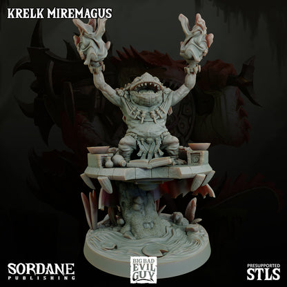 A Krelk Miremagus miniature raising flaming hands atop a swampy altar, surrounded by magical artifacts.