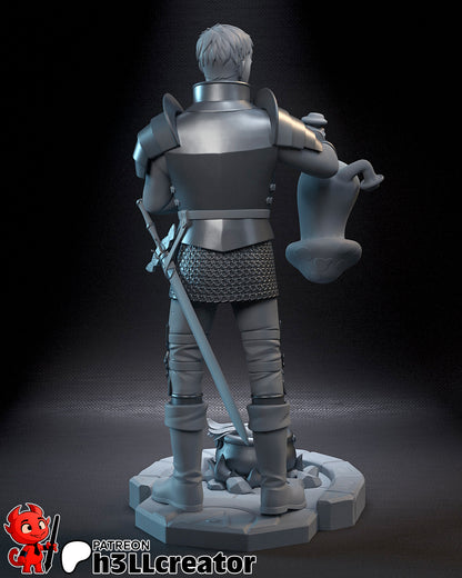 Rear view of the Laios figure showing detailed armor, chainmail, sword on back, and base stones around the cauldron.