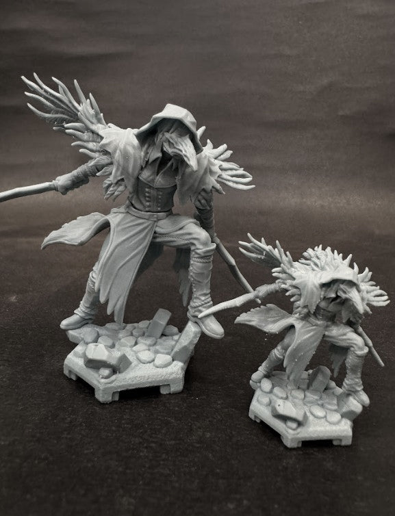 Comparison of LawII Crow Set miniatures in different sizes, both posed on stone bases.