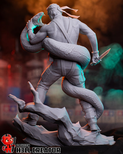 Big Boss Metal Gear Solid 1:8 scale statue unpainted rear angle showing snake coiled around body, knife ready, and rocky base.