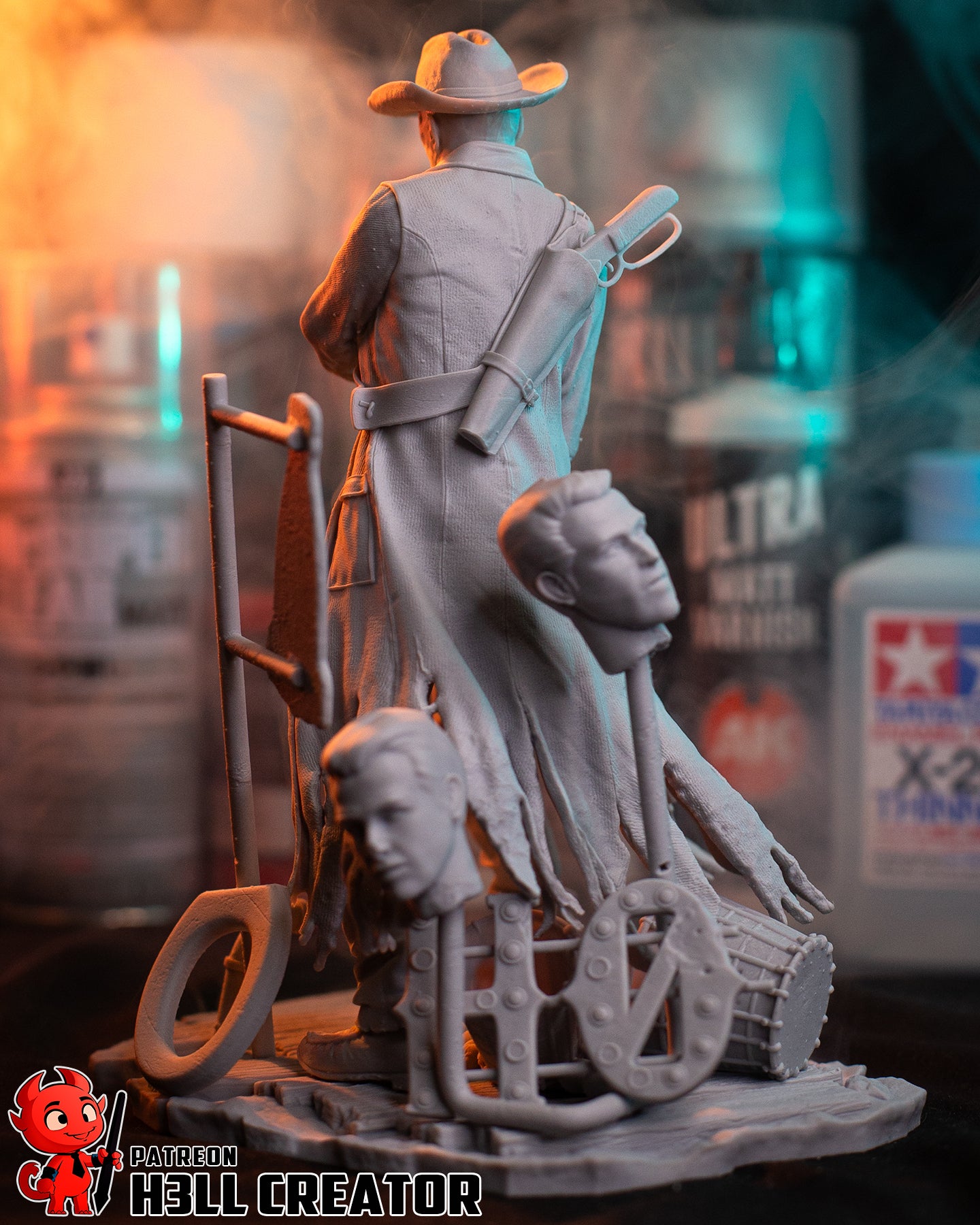 Unpainted Fallout The Ghoul figure rear view, showing rifle scabbard, tattered coat, heads and base terrain accessories, 1:8 scale.