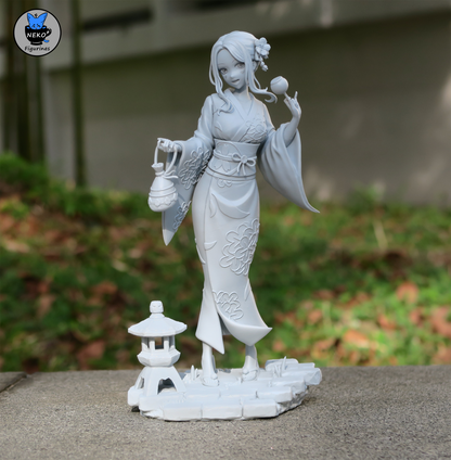 Front view of 1:8 scale Marin Kitagawa collectible in yukata with candy apple and lantern on stone base with Japanese lantern prop.