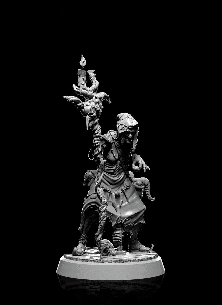 Morvina Mirewood, a twisted witch miniature holding a gnarled staff. Her attire is tattered, and she has a menacing expression, complete with various eerie adornments and details. Ideal for dark fantasy tabletop RPG settings.