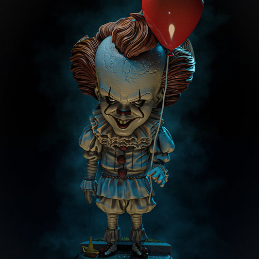 Chibi Pennywise collectible figure from IT, holding a red balloon and wearing a ruffled clown suit, standing on a base with a paper boat.