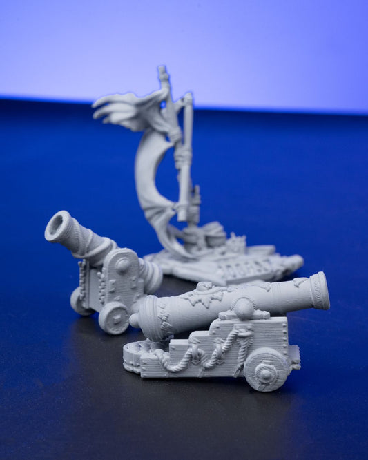 A collection of three detailed cannons, each featuring ornate engravings and nautical designs, perfect for seafaring tabletop RPG settings.