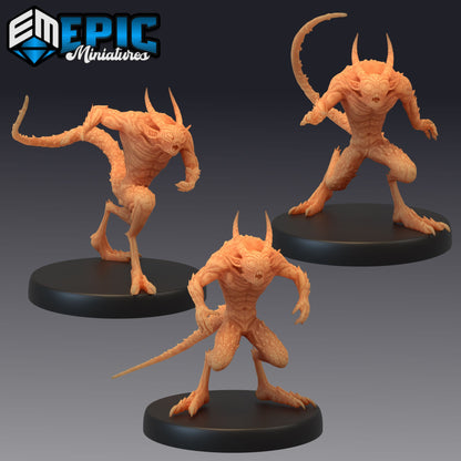 Group of three Quasit miniatures in various stances, showcasing their threatening poses, claws, and horns, fitting for dark fantasy TTRPG campaigns.